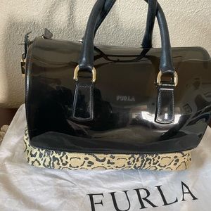 Furla candy purse with animal print leather bottom .